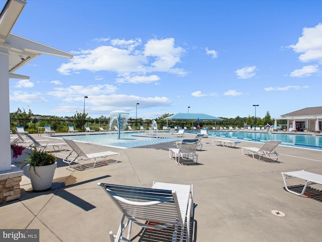 community pool with a patio area