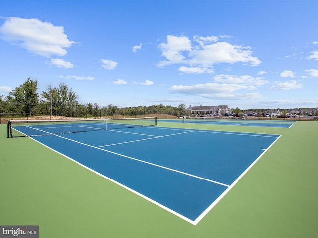 view of sport court with fence