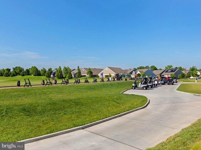 view of community with a lawn and a residential view