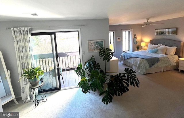 bedroom featuring ceiling fan, visible vents, carpet, and access to exterior