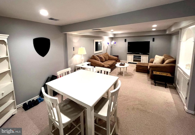 dining space featuring visible vents, recessed lighting, light colored carpet, and baseboards