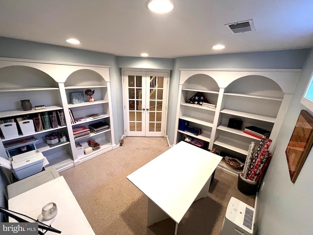 carpeted home office with visible vents, recessed lighting, and french doors