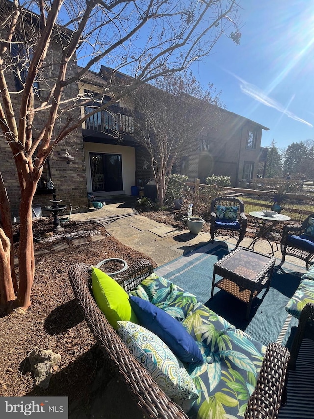 exterior space featuring an outdoor living space and a balcony