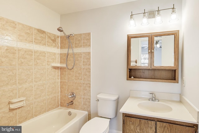 bathroom with vanity, toilet, and  shower combination