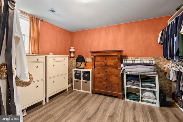 bedroom with visible vents and light wood-type flooring