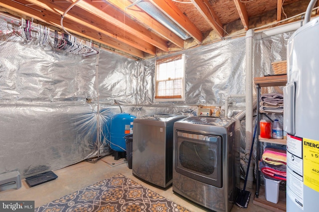 laundry room featuring separate washer and dryer, water heater, and laundry area