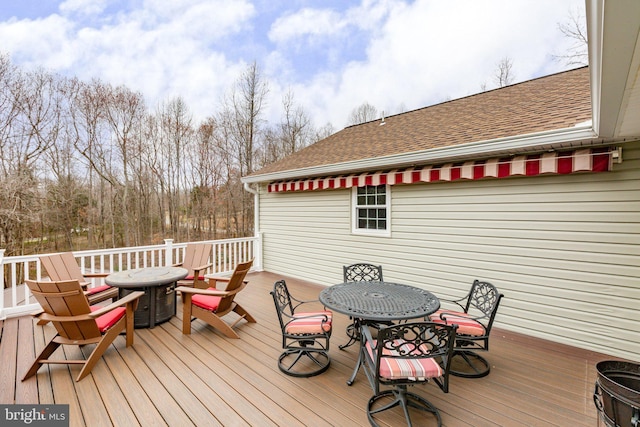 deck with outdoor dining area