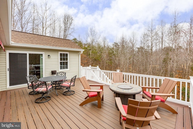 wooden deck with outdoor dining area