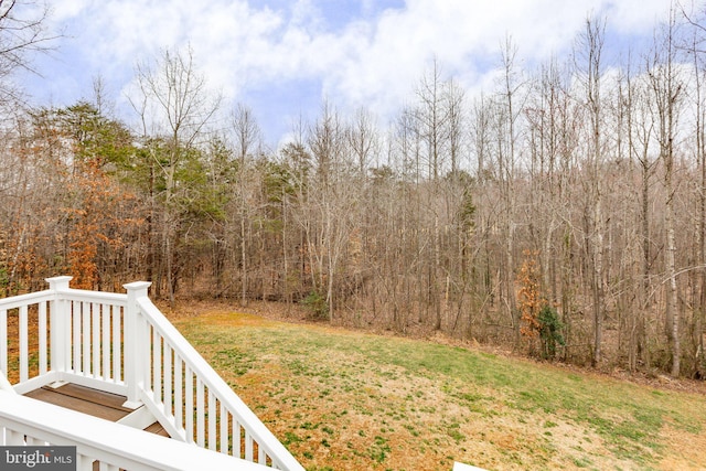 view of yard with a forest view