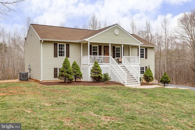 view of front of house featuring stairs, a front lawn, and covered porch