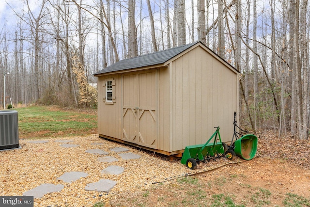 view of shed with central air condition unit