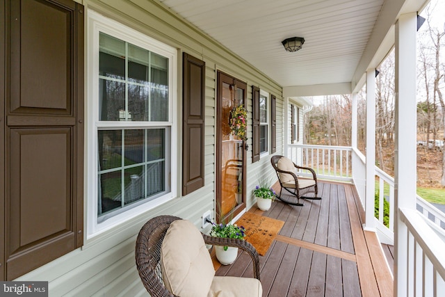 wooden terrace featuring a porch