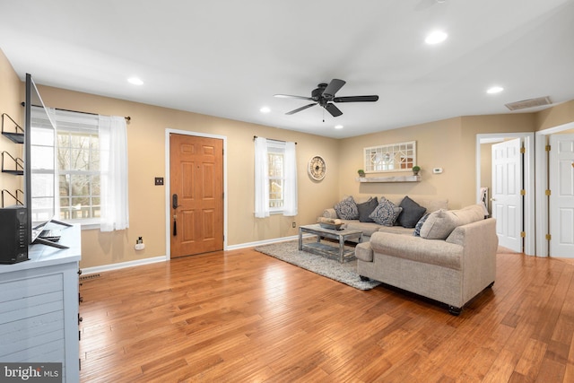 living area with recessed lighting, light wood-style flooring, and ceiling fan