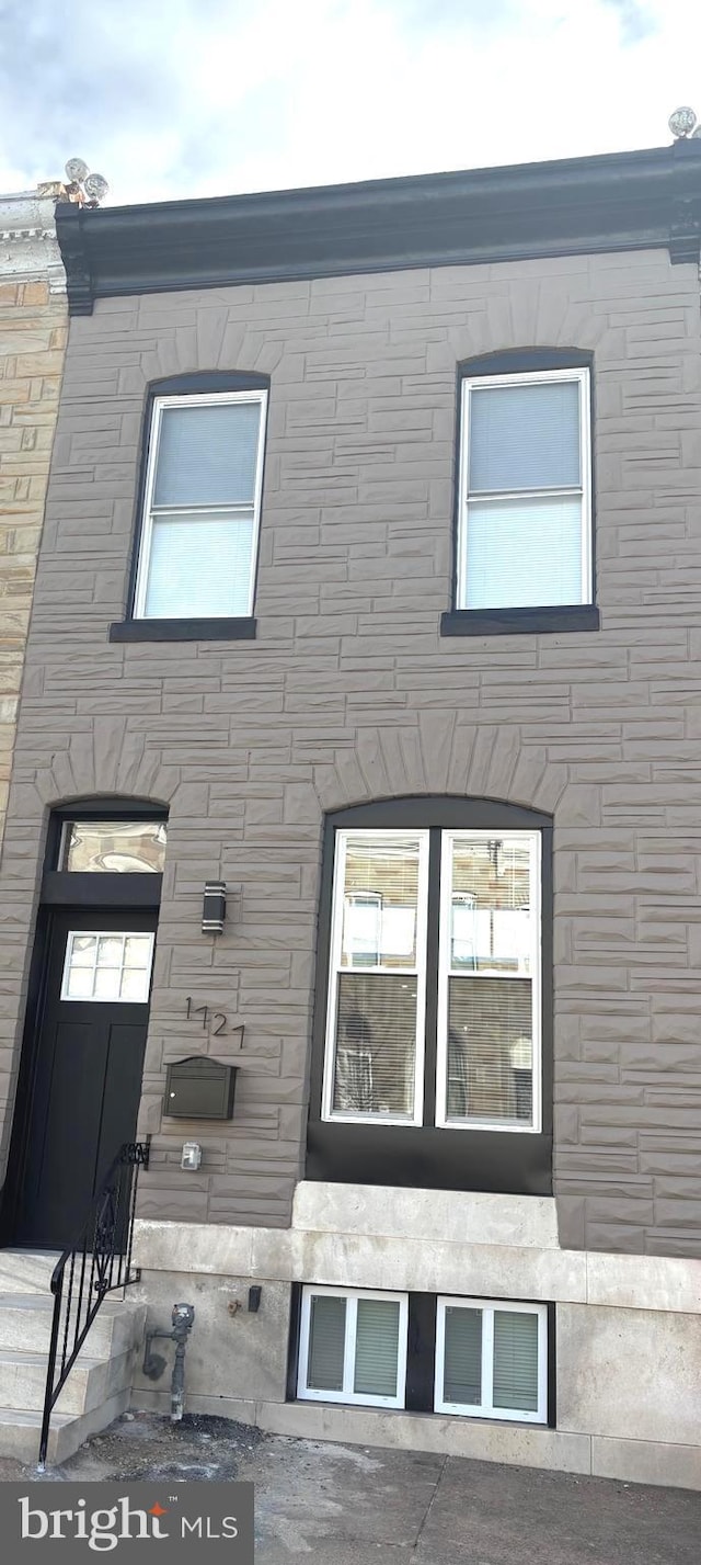 view of front of home with stone siding