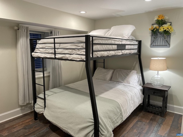 bedroom with recessed lighting, baseboards, and wood finished floors