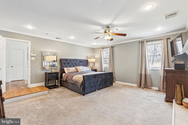 bedroom with visible vents, carpet, and ornamental molding