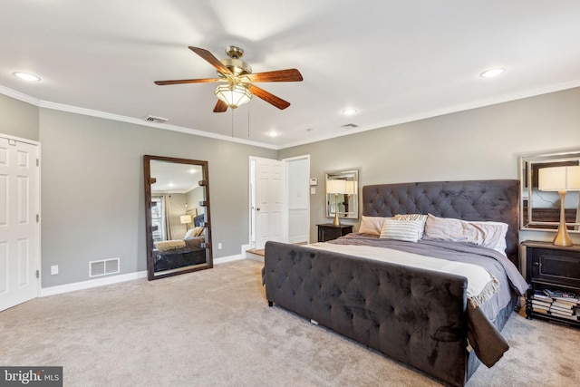 carpeted bedroom with visible vents, recessed lighting, baseboards, and ornamental molding