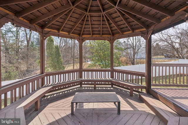 deck featuring a gazebo and fence