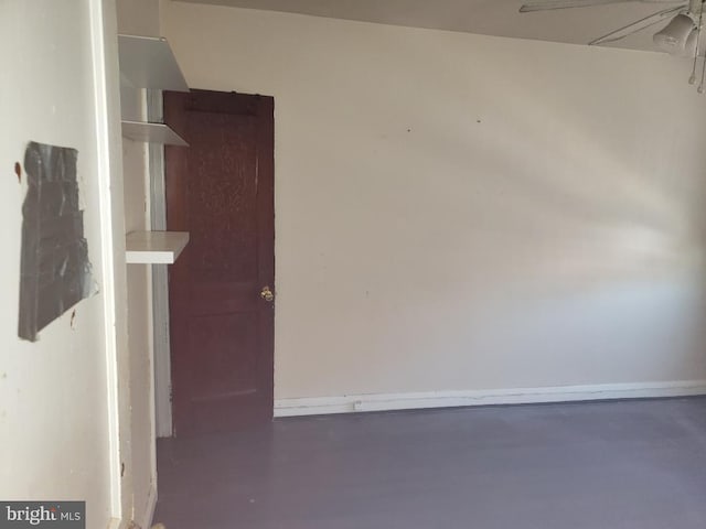 unfurnished room with finished concrete flooring