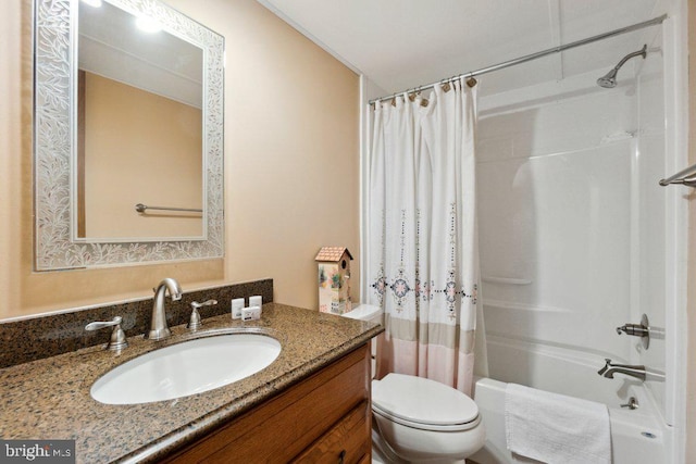 full bathroom with vanity, toilet, and shower / bath combo with shower curtain