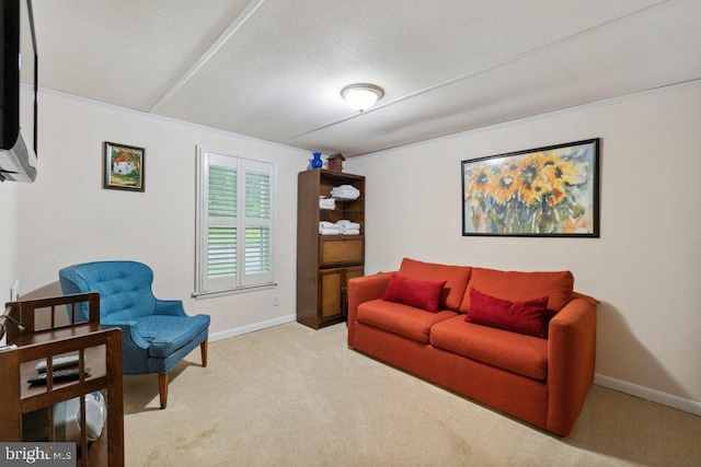 living room with baseboards, a textured ceiling, and carpet flooring