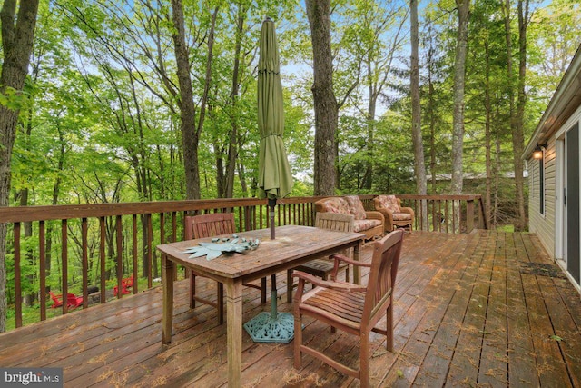 deck with outdoor dining area