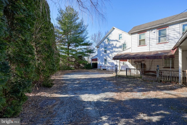 view of side of home with driveway