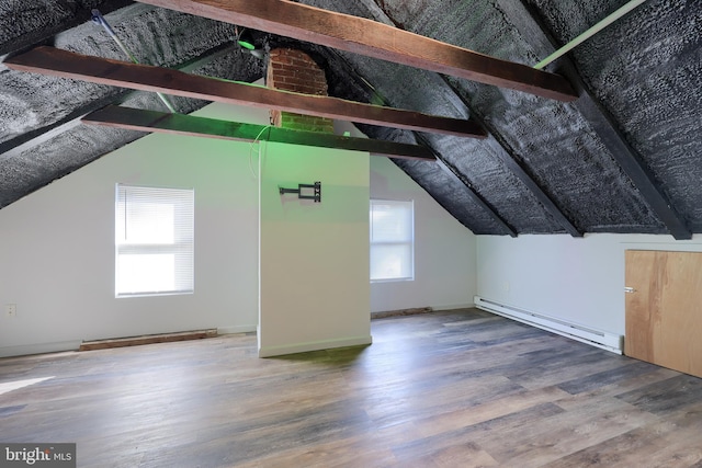 bonus room with a baseboard heating unit, vaulted ceiling with beams, and wood finished floors