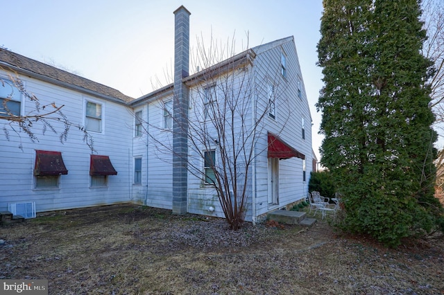 exterior space featuring a chimney