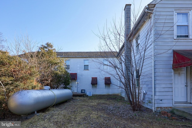 view of home's exterior with a chimney