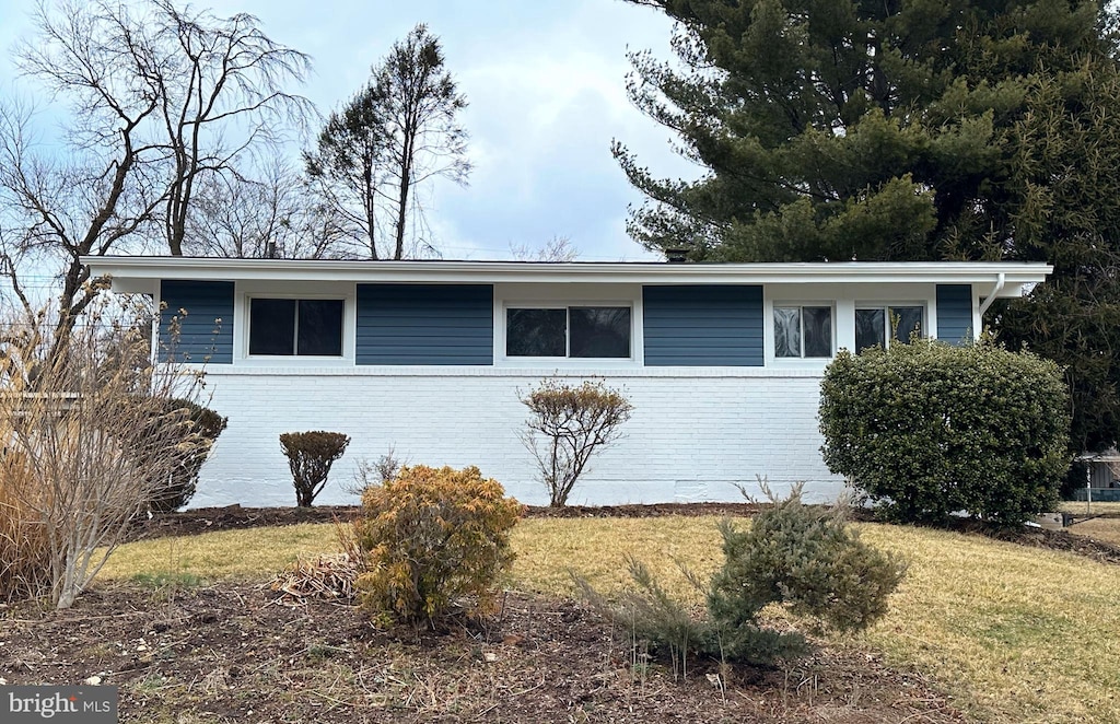 view of front of home with brick siding