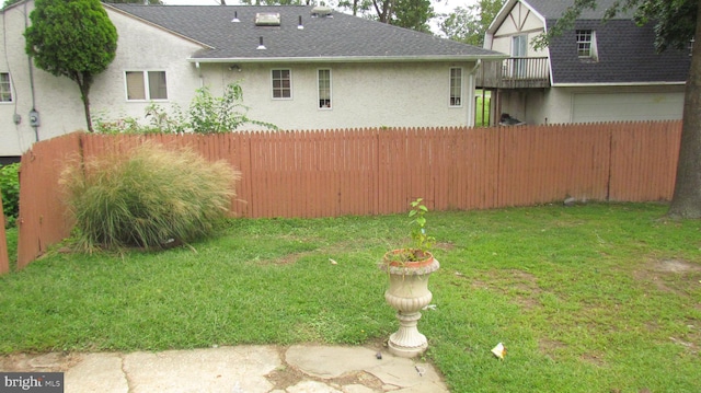 view of yard with a garage and fence