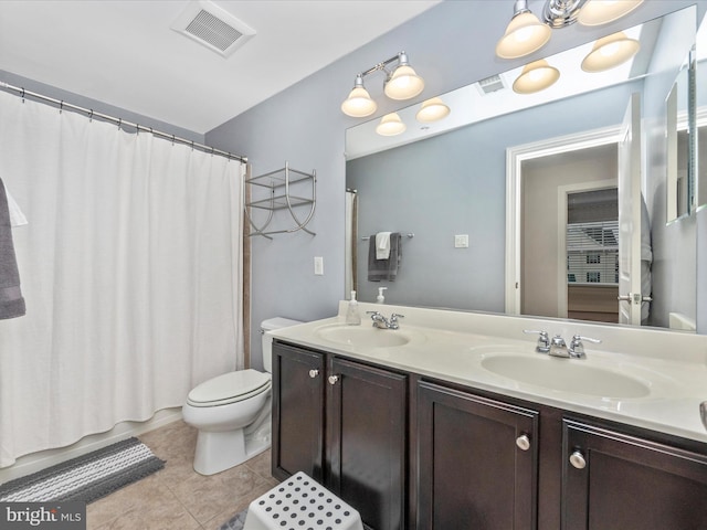 full bathroom featuring a sink, visible vents, toilet, and double vanity