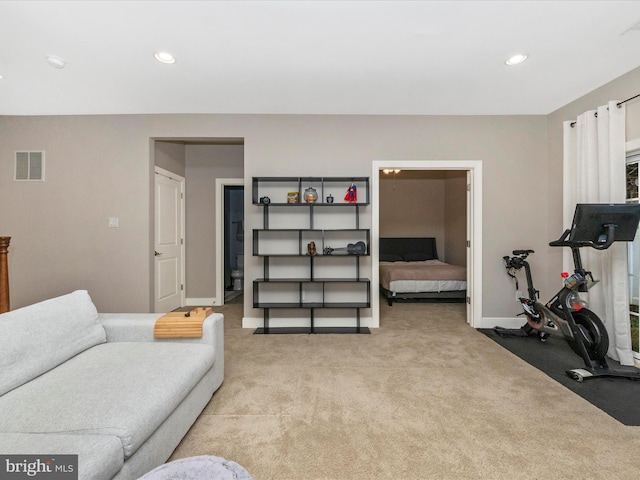 interior space with light carpet, visible vents, recessed lighting, and baseboards