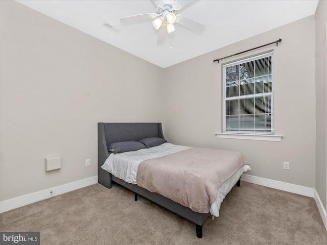 bedroom featuring baseboards, carpet, and a ceiling fan