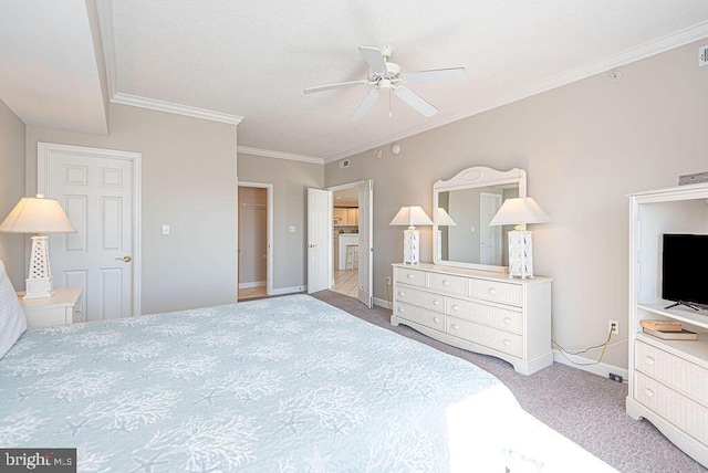 carpeted bedroom with baseboards, ceiling fan, and crown molding