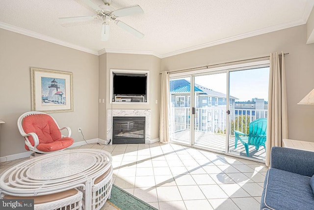 living room featuring a high end fireplace, a textured ceiling, crown molding, and light tile patterned flooring