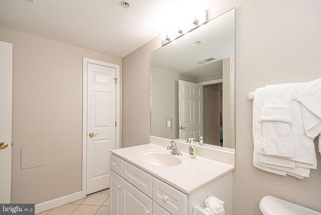 bathroom with tile patterned floors, visible vents, toilet, baseboards, and vanity