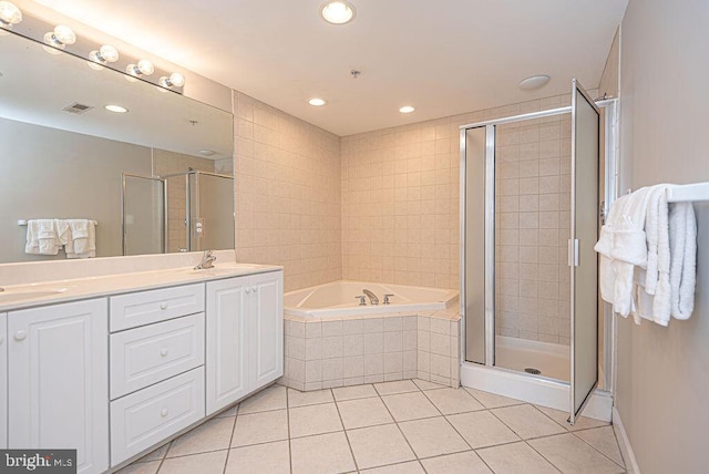 full bathroom with a garden tub, visible vents, double vanity, a shower stall, and tile patterned floors