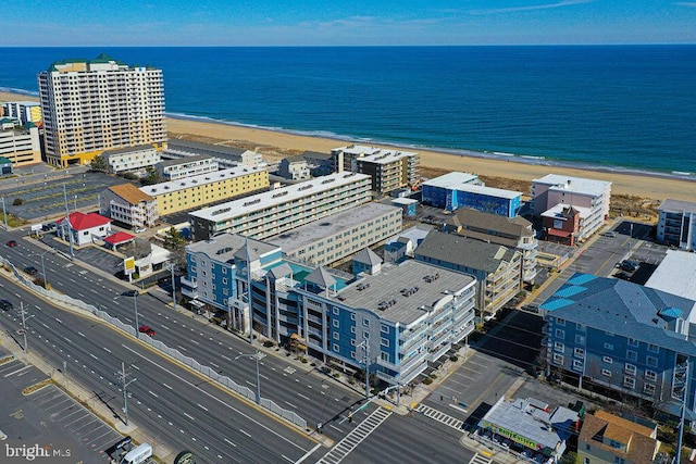 drone / aerial view with a view of the beach and a water view