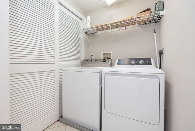 clothes washing area with laundry area and washer and dryer