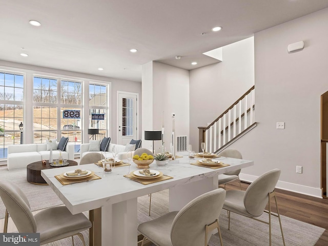 dining area with recessed lighting, baseboards, and dark wood finished floors