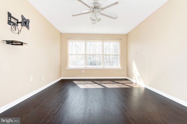 empty room with ceiling fan, baseboards, and hardwood / wood-style floors