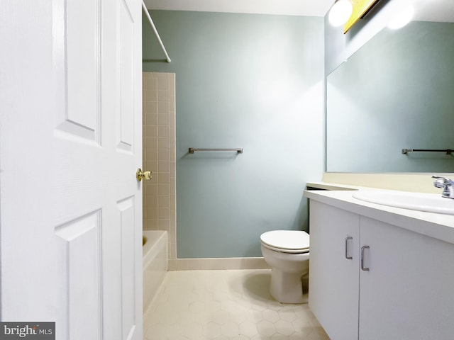 bathroom with tile patterned floors, toilet, tub / shower combination, and vanity