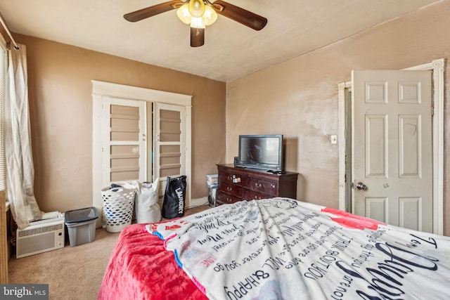 carpeted bedroom with a ceiling fan