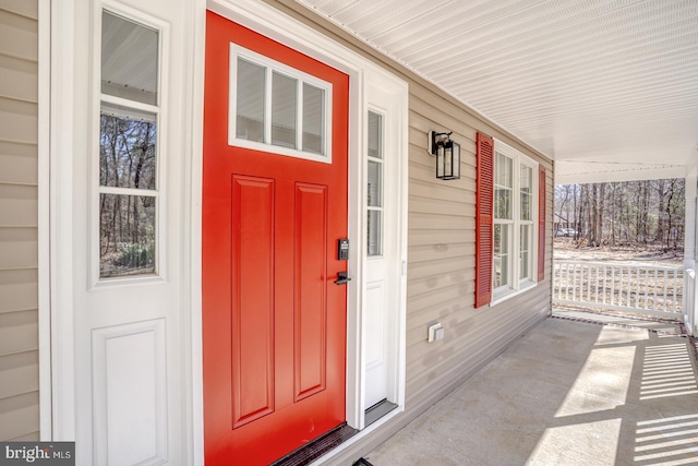 doorway to property featuring a porch