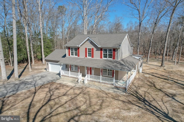 view of front of house featuring aphalt driveway, a porch, an attached garage, and a shingled roof