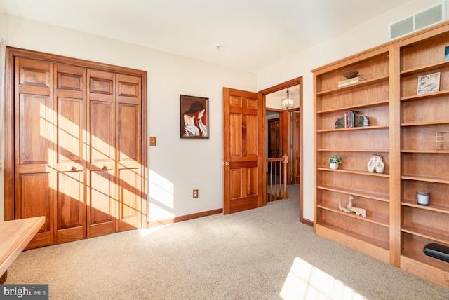 unfurnished bedroom with visible vents, baseboards, and carpet floors