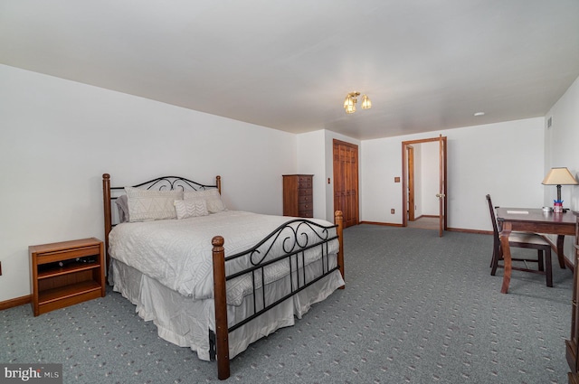 carpeted bedroom with baseboards