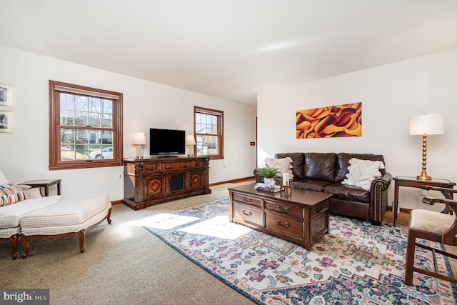 living room with light carpet and baseboards